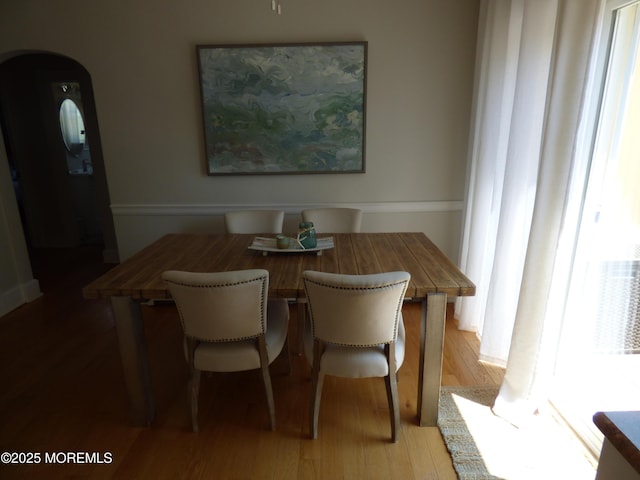 91 Center Ave, Atlantic Highlands, NJ 07716 - dining space with arched walkways and light wood finished floors