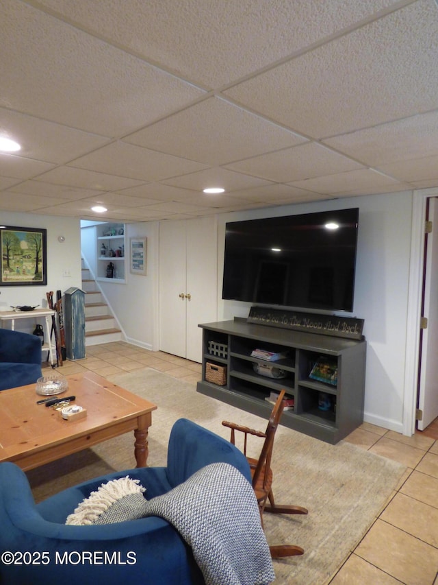 91 Center Ave, Atlantic Highlands, NJ 07716 - living area with tile patterned floors, stairway, and a drop ceiling