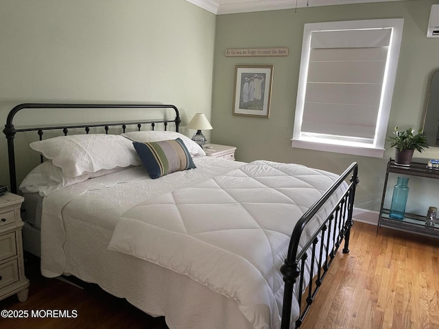 91 Center Ave, Atlantic Highlands, NJ 07716 - bedroom featuring wood finished floors, crown molding, and a wall unit AC