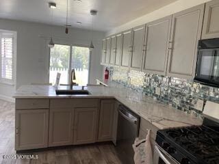 114 Mohican Ln, Little Egg Harbor, NJ 08087 - kitchen featuring stainless steel appliances, a sink, plenty of natural light, and a peninsula