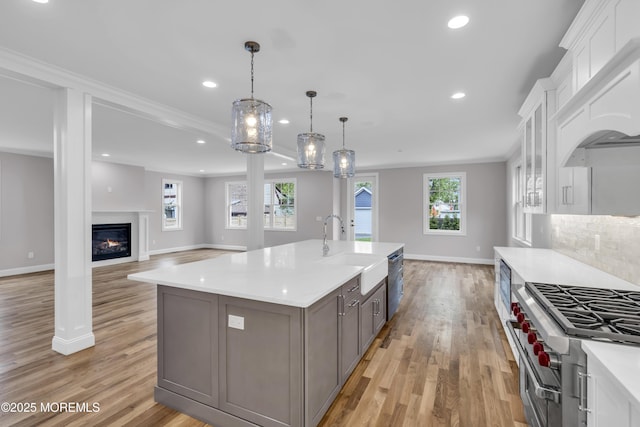 516 13th Ave, Belmar, NJ 07719 - kitchen with a sink, stainless steel appliances, light countertops, custom exhaust hood, and recessed lighting