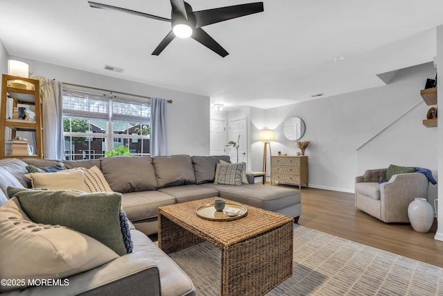 108 Drs James Parker Blvd Unit D8, Red Bank, NJ 07701 - living area featuring wood finished floors, a ceiling fan, and baseboards