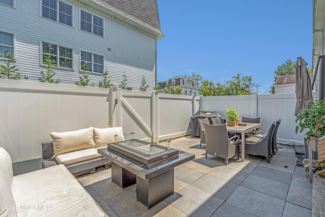 108 Drs James Parker Blvd Unit D8, Red Bank, NJ 07701 - fenced backyard with an outdoor hangout area, a patio area, outdoor dining area, and a gate