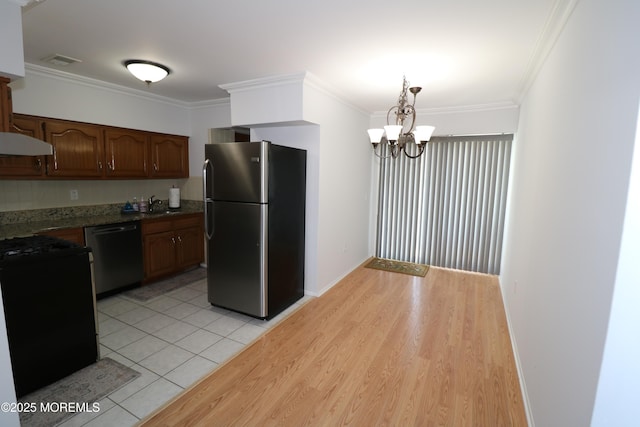 15 Iowa Ct Unit 621, Matawan, NJ 07747 - kitchen with appliances with stainless steel finishes, under cabinet range hood, ornamental molding, a chandelier, and decorative light fixtures