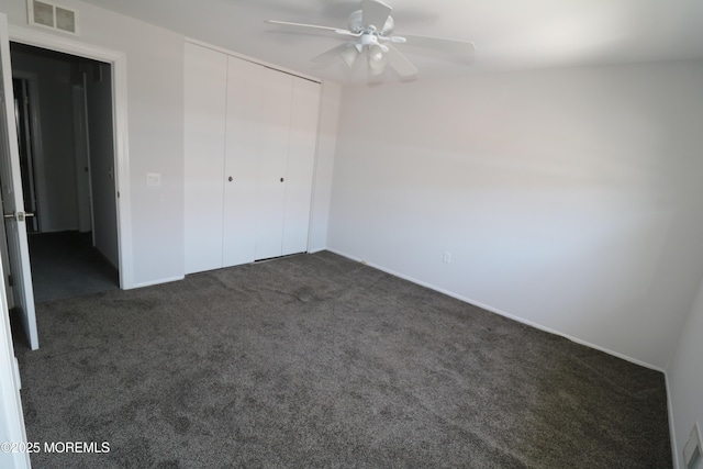 15 Iowa Ct Unit 621, Matawan, NJ 07747 - unfurnished bedroom featuring dark carpet, a closet, and a ceiling fan