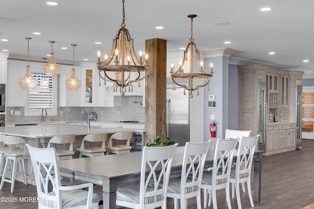 1055 Ocean Ave, Mantoloking, NJ 08738 - dining room with a chandelier, recessed lighting, dark wood-style floors, and ornamental molding