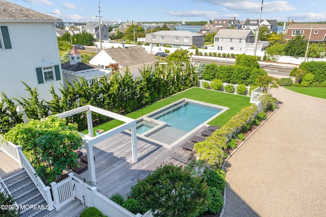 1055 Ocean Ave, Mantoloking, NJ 08738 - view of swimming pool featuring a residential view, a fenced backyard, and a pool with connected hot tub