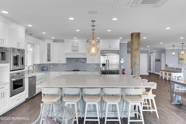 1055 Ocean Ave, Mantoloking, NJ 08738 - kitchen with appliances with stainless steel finishes, light countertops, decorative backsplash, premium range hood, and crown molding