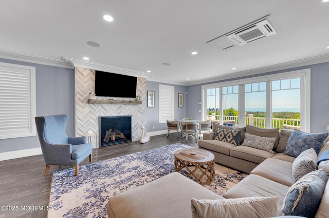 1055 Ocean Ave, Mantoloking, NJ 08738 - living room featuring baseboards, crown molding, a tile fireplace, wood finished floors, and recessed lighting