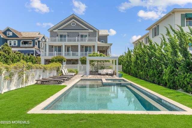 1055 Ocean Ave, Mantoloking, NJ 08738 - rear view of house featuring a balcony, a patio, an outdoor living space, and a pool with connected hot tub