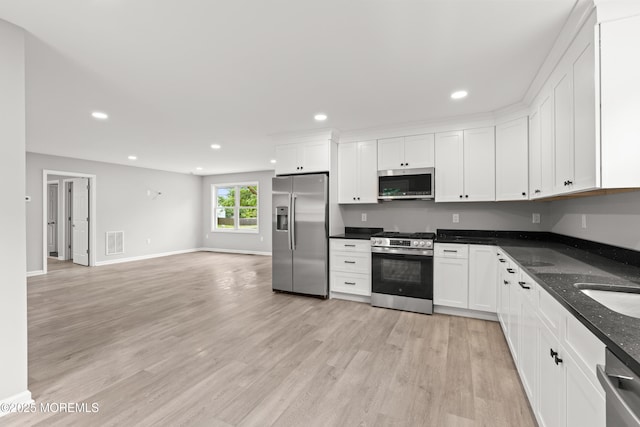 53 Burnt Tavern Rd, Brick, NJ 08724 - kitchen with appliances with stainless steel finishes, light wood-type flooring, white cabinetry, recessed lighting, and baseboards
