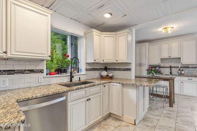 29 Grand Ave, Atlantic Highlands, NJ 07716 - kitchen with a sink, stainless steel dishwasher, decorative backsplash, and light stone counters