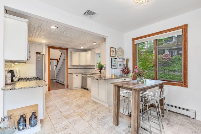 29 Grand Ave, Atlantic Highlands, NJ 07716 - kitchen featuring a baseboard radiator, stainless steel appliances, light stone counters, recessed lighting, and a sink