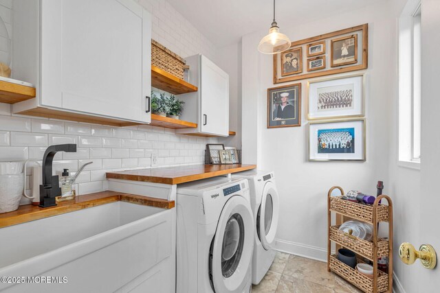 29 Grand Ave, Atlantic Highlands, NJ 07716 - laundry area featuring cabinet space, baseboards, and washing machine and dryer
