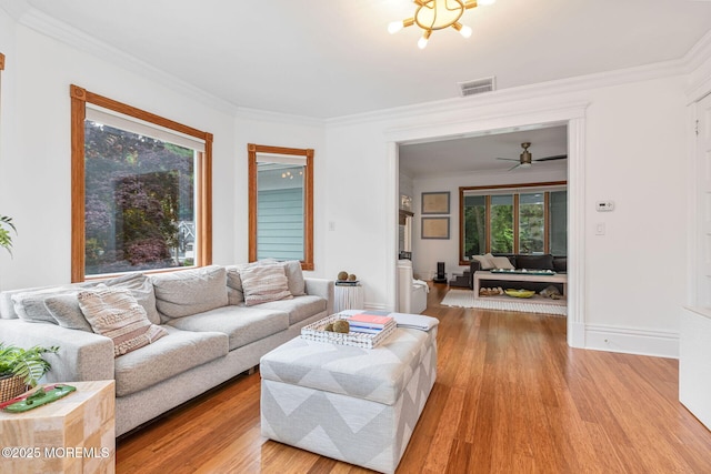 29 Grand Ave, Atlantic Highlands, NJ 07716 - living room with wood finished floors, healthy amount of natural light, crown molding, and ceiling fan
