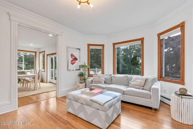 29 Grand Ave, Atlantic Highlands, NJ 07716 - living room with a baseboard heating unit, light wood finished floors, and ornamental molding