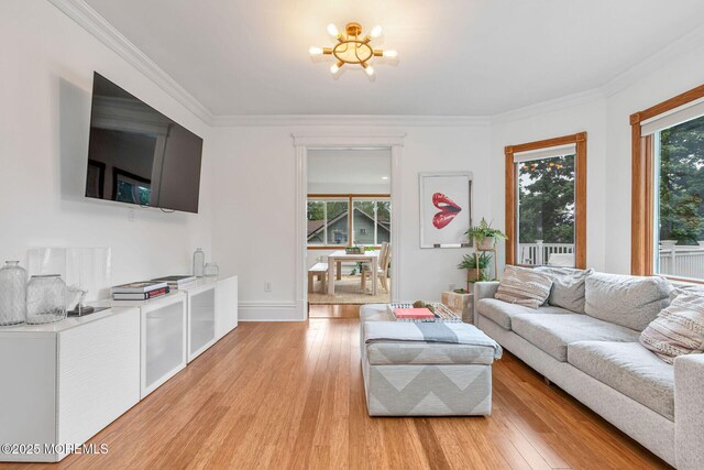 29 Grand Ave, Atlantic Highlands, NJ 07716 - living room featuring light wood-style floors, a chandelier, crown molding, and baseboards