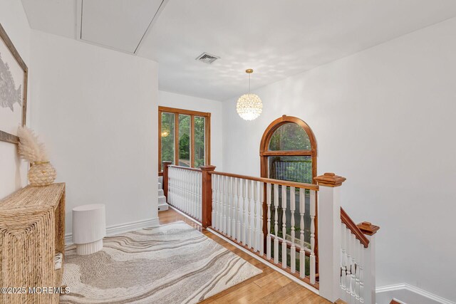 29 Grand Ave, Atlantic Highlands, NJ 07716 - hall featuring an upstairs landing, wood finished floors, attic access, and baseboards