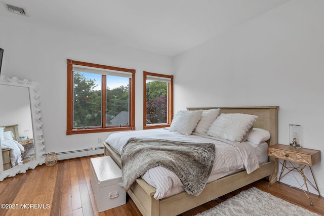 29 Grand Ave, Atlantic Highlands, NJ 07716 - bedroom featuring a baseboard heating unit and wood finished floors