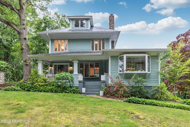 29 Grand Ave, Atlantic Highlands, NJ 07716 - american foursquare style home with covered porch, a front lawn, and a chimney
