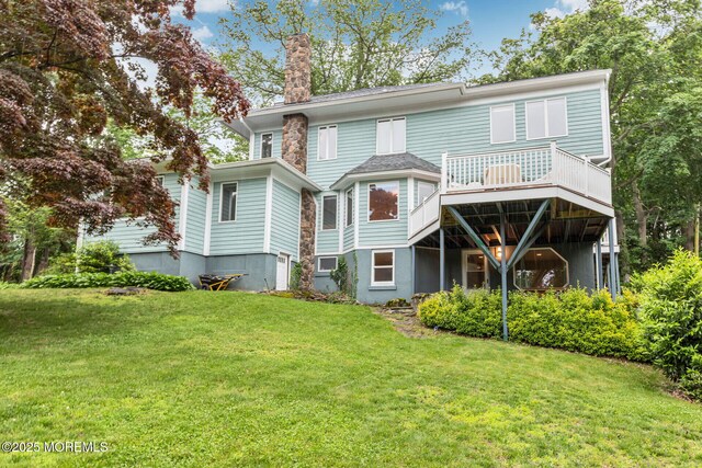 29 Grand Ave, Atlantic Highlands, NJ 07716 - rear view of house featuring a chimney, a lawn, and a deck