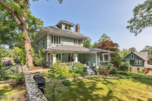 29 Grand Ave, Atlantic Highlands, NJ 07716 - view of front of home with covered porch, a chimney, and a front lawn