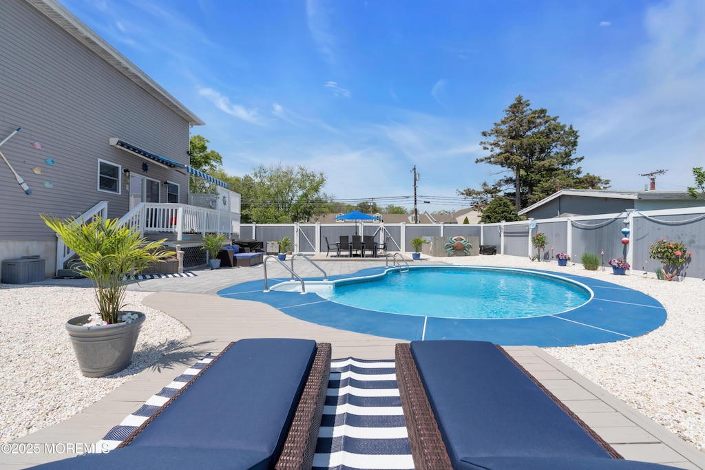 23 Charles Blvd, Manahawkin, NJ 08050 - view of swimming pool with a wooden deck, a fenced backyard, and a patio