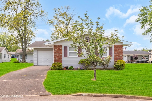 5 Spenser Ct, Brick, NJ 08724 - ranch-style home with an attached garage, driveway, a front yard, and brick siding