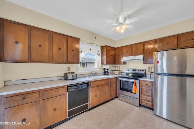 5 Spenser Ct, Brick, NJ 08724 - kitchen featuring stainless steel appliances, under cabinet range hood, brown cabinetry, and a sink