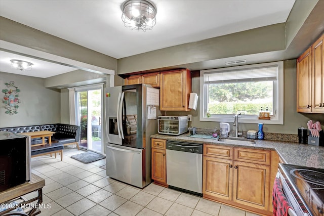 15 Transom Ln, Barnegat, NJ 08005 - kitchen with appliances with stainless steel finishes, a sink, light tile patterned flooring, and brown cabinets
