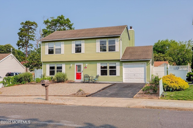 15 Transom Ln, Barnegat, NJ 08005 - colonial home with an attached garage, a chimney, and driveway
