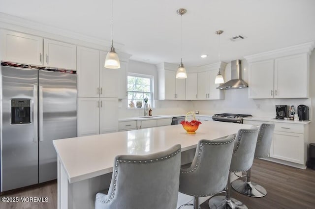 257 Port Monmouth Rd, North Middletown, NJ 07748 - kitchen featuring stainless steel appliances, wall chimney exhaust hood, dark wood finished floors, white cabinets, and recessed lighting