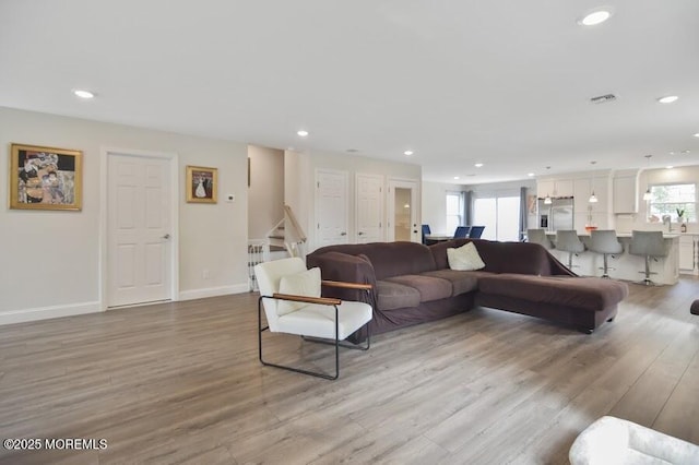 257 Port Monmouth Rd, North Middletown, NJ 07748 - living area featuring light wood-style floors, healthy amount of natural light, recessed lighting, and stairway