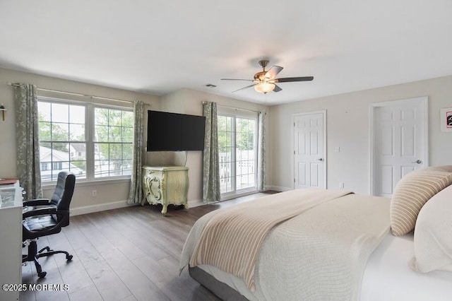 257 Port Monmouth Rd, North Middletown, NJ 07748 - bedroom featuring wood finished floors, an office area, and ceiling fan