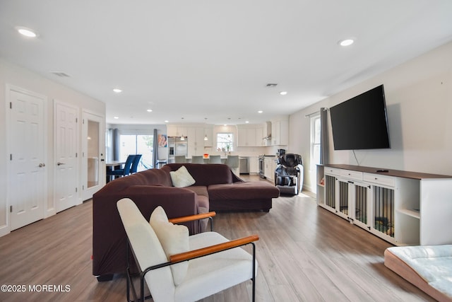 257 Port Monmouth Rd, North Middletown, NJ 07748 - living room featuring healthy amount of natural light, light wood-style floors, and recessed lighting