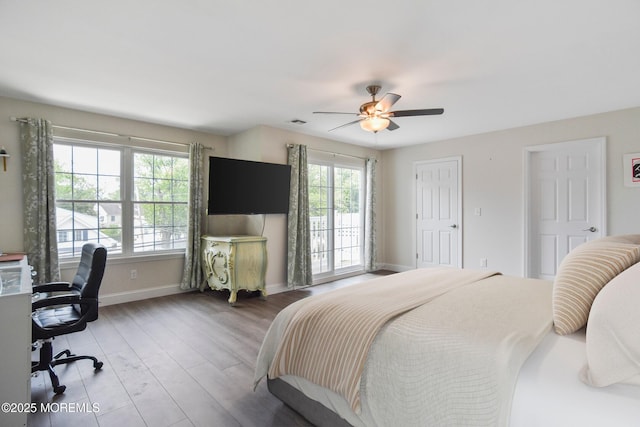 257 Port Monmouth Rd, North Middletown, NJ 07748 - bedroom featuring wood finished floors, an office area, and ceiling fan