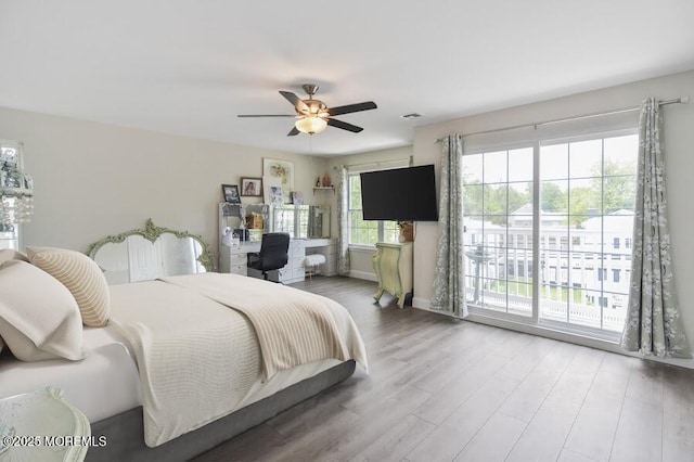 257 Port Monmouth Rd, North Middletown, NJ 07748 - bedroom with access to exterior, wood finished floors, and a ceiling fan