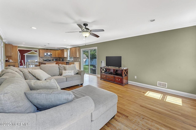 531 Parker Ave, Brick, NJ 08724 - living room featuring crown molding, baseboards, recessed lighting, ceiling fan, and light wood finished floors
