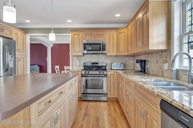 531 Parker Ave, Brick, NJ 08724 - kitchen featuring appliances with stainless steel finishes, a sink, decorative columns, ornamental molding, and light wood-style floors