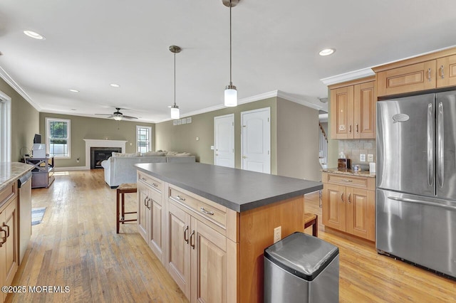 531 Parker Ave, Brick, NJ 08724 - kitchen featuring freestanding refrigerator, a ceiling fan, crown molding, light wood-type flooring, and a center island