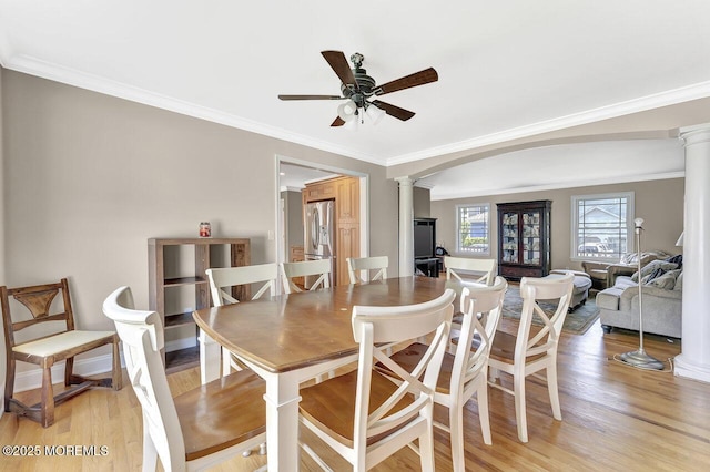 531 Parker Ave, Brick, NJ 08724 - dining room featuring decorative columns, ornamental molding, ceiling fan, light wood finished floors, and arched walkways
