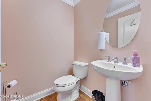 531 Parker Ave, Brick, NJ 08724 - bathroom with baseboards, toilet, crown molding, and wood finished floors