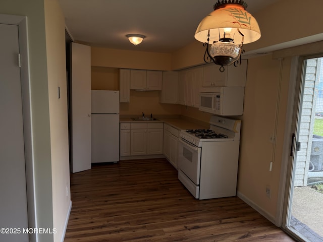 5 Texas Ct Unit B, Matawan, NJ 07747 - kitchen featuring white appliances, dark wood-style floors, white cabinets, baseboards, and a sink