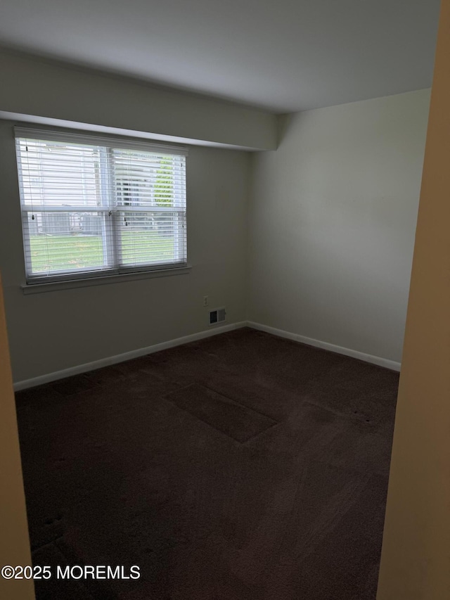 5 Texas Ct Unit B, Matawan, NJ 07747 - empty room with dark colored carpet and baseboards