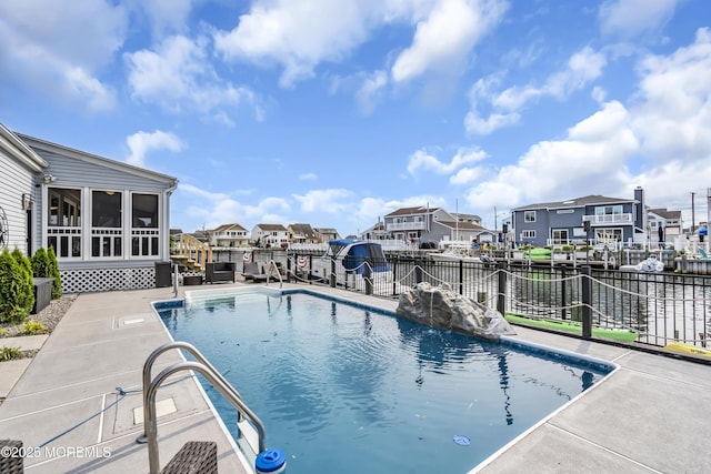 1213 Ariel Dr, Forked River, NJ 08731 - view of swimming pool featuring a residential view, a water view, and a sunroom