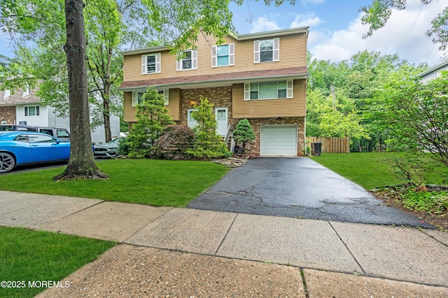 20 Lone Star Ln, Manalapan, NJ 07726 - view of front of home with driveway, a garage, and brick siding
