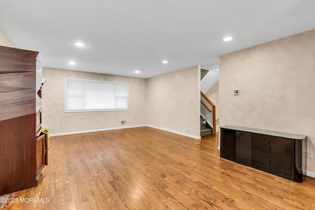 20 Lone Star Ln, Manalapan, NJ 07726 - unfurnished living room featuring stairs, light wood finished floors, recessed lighting, and baseboards