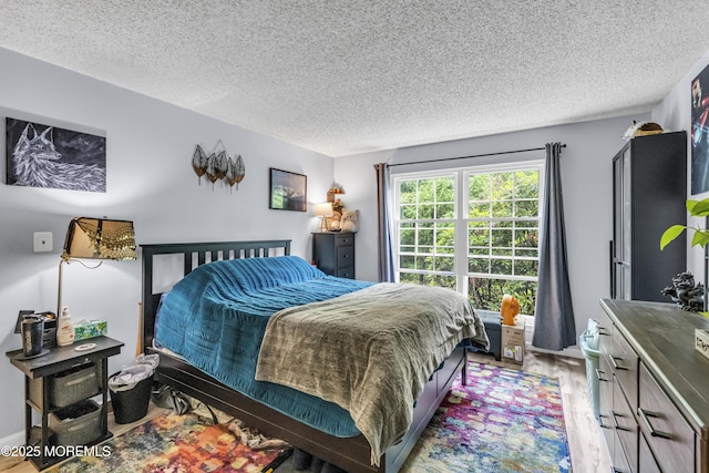 69 Rachel Ct, Franklin Twp, NJ 08823 - bedroom with wood finished floors and a textured ceiling