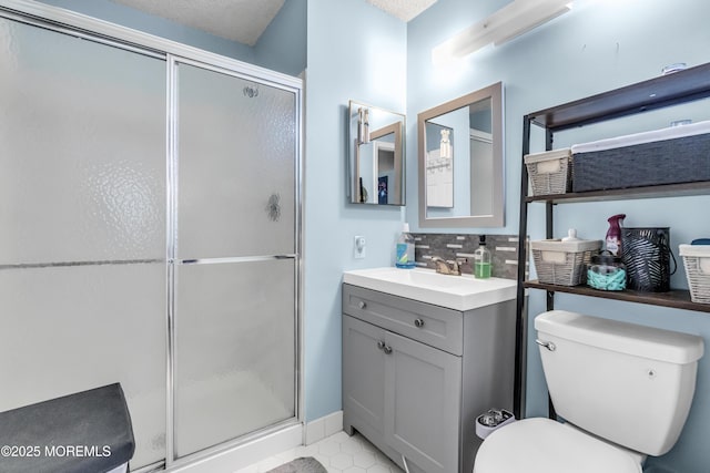 69 Rachel Ct, Franklin Twp, NJ 08823 - full bath with a stall shower, backsplash, vanity, and toilet