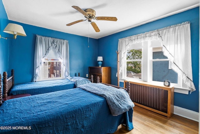 510 Bradley Blvd, Bradley Beach, NJ 07720 - bedroom with radiator heating unit, wood finished floors, a ceiling fan, and baseboards